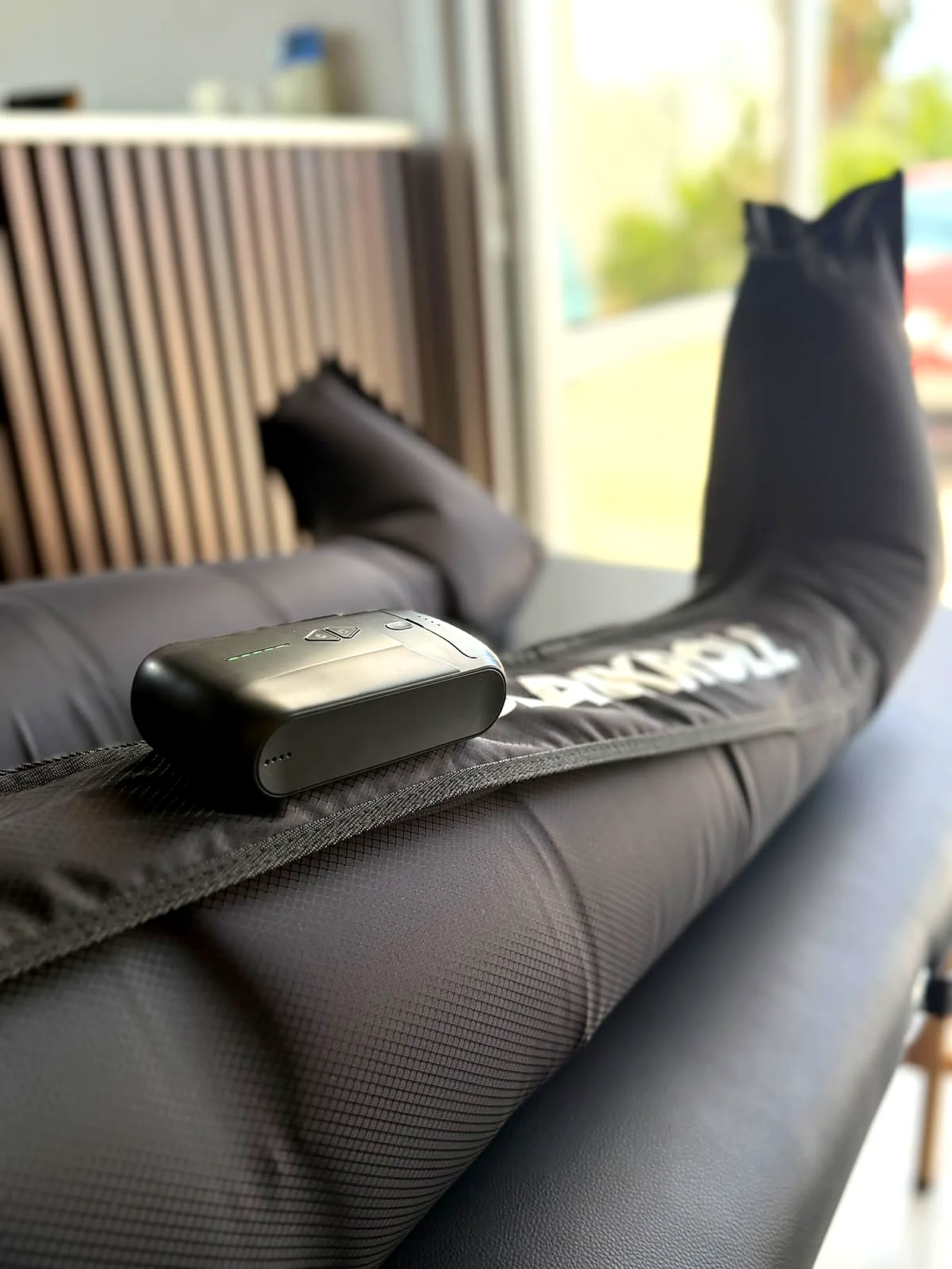 Compression boots on a treatment bed for recovery therapy at Rewell Emotion Fitness, Peyia